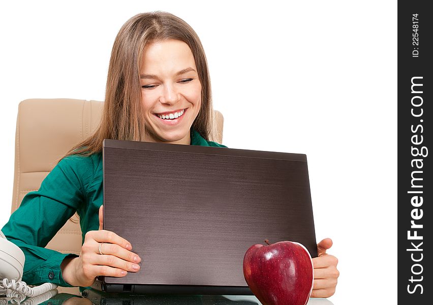 Beautiful smiling woman office worker with laptop and apple isolated on white. Beautiful smiling woman office worker with laptop and apple isolated on white