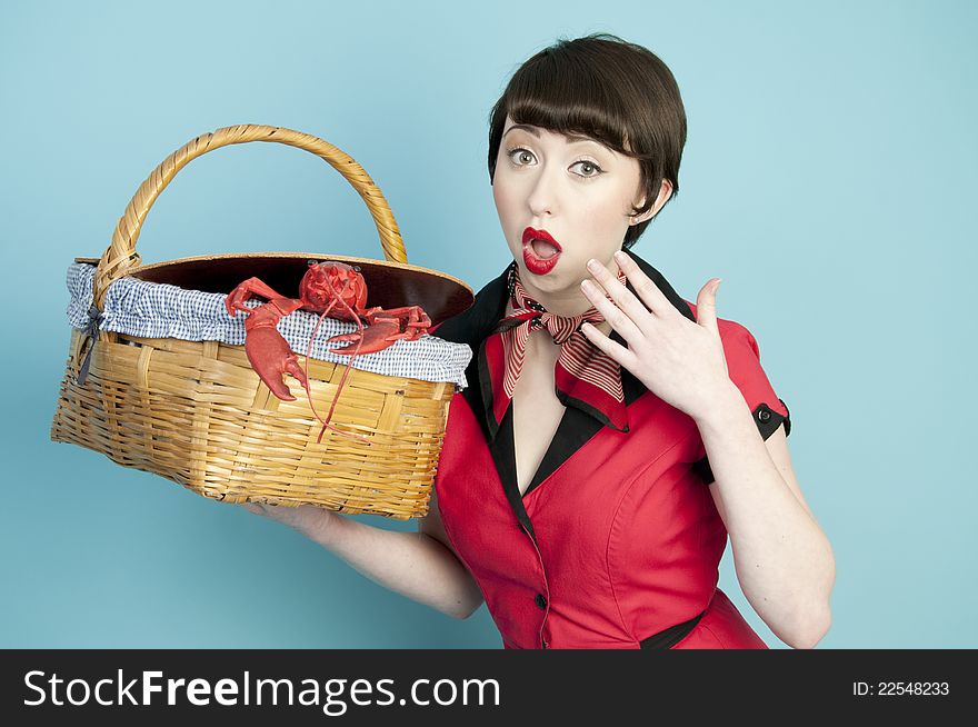 Pinup model with red lobster with surprised expression. Pinup model with red lobster with surprised expression