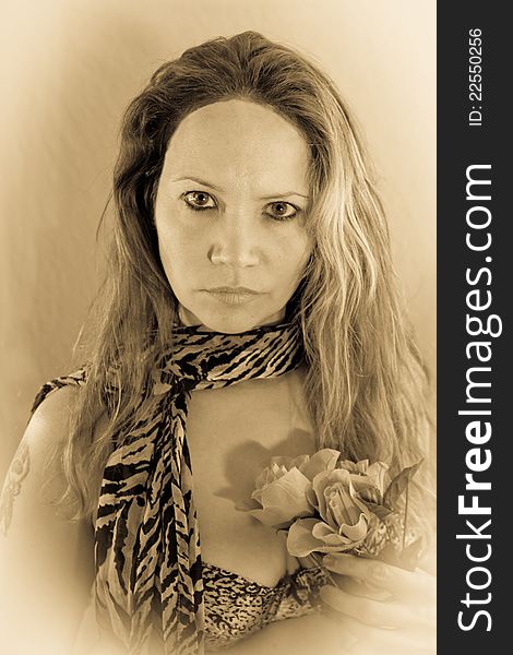 Faded female posing with a leopard scarf and flowers. Faded female posing with a leopard scarf and flowers
