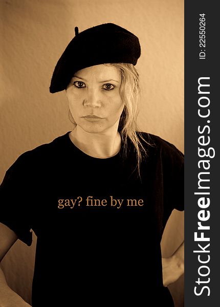 Female in hat with shirt printed gay fine by me. Female in hat with shirt printed gay fine by me