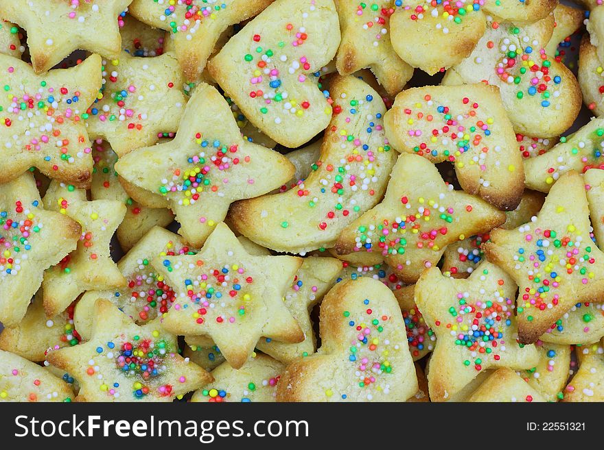 Heaps of freshly baked German Christmas cookies in different shapes - called ButterplÃ¤tzchen . Heaps of freshly baked German Christmas cookies in different shapes - called ButterplÃ¤tzchen