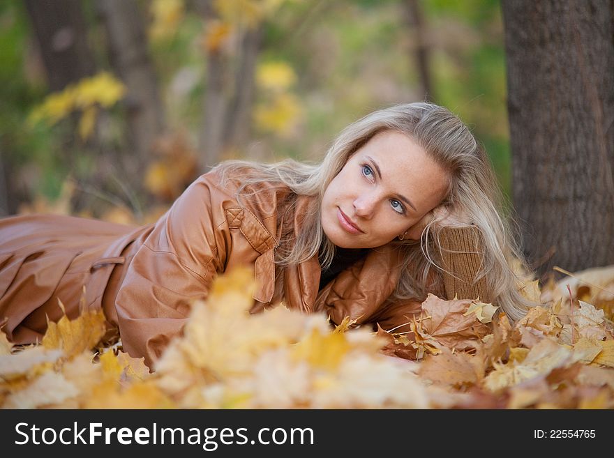 The girl on a walk in the autumn park