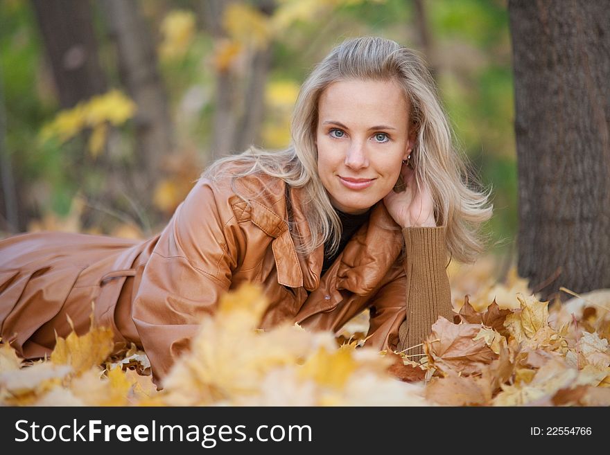 The girl on a walk in the autumn park