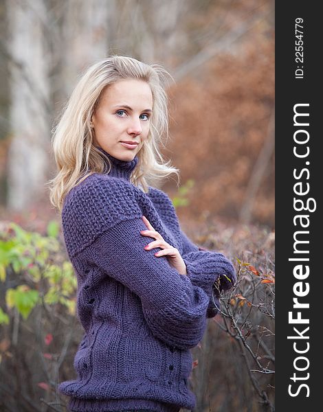 Girl on a walk in the autumn park