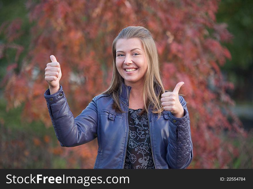 Pretty positive girl with thumbs up