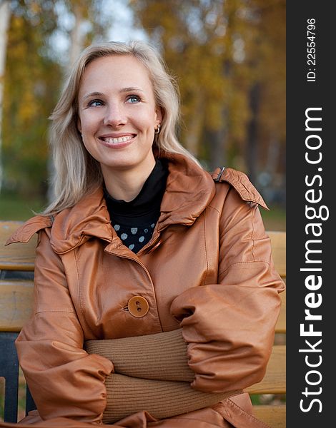 The girl on a walk in the autumn park. The girl on a walk in the autumn park