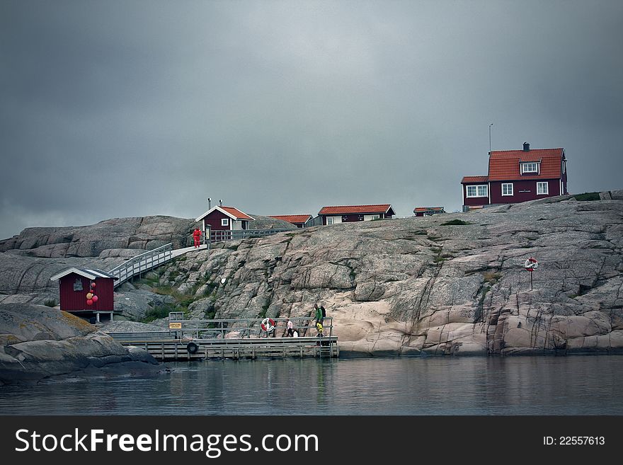 Small houses on little island on west coast in Sweden