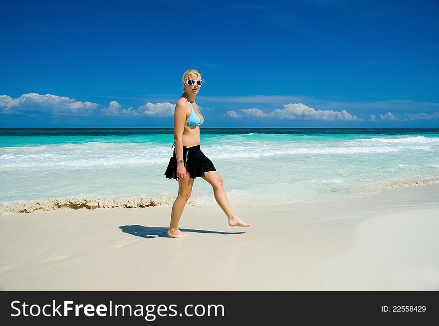 Woman On A White Sand Beach