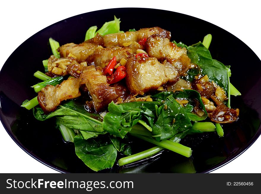 Thai stir fried chinese kale with crispy pork