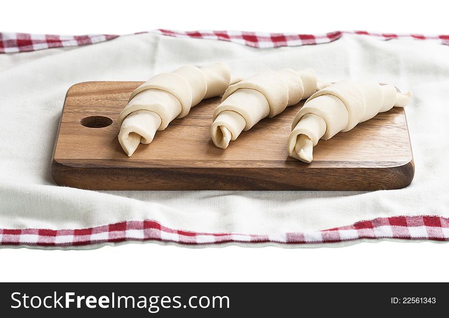 Raw croissants prepared for baking