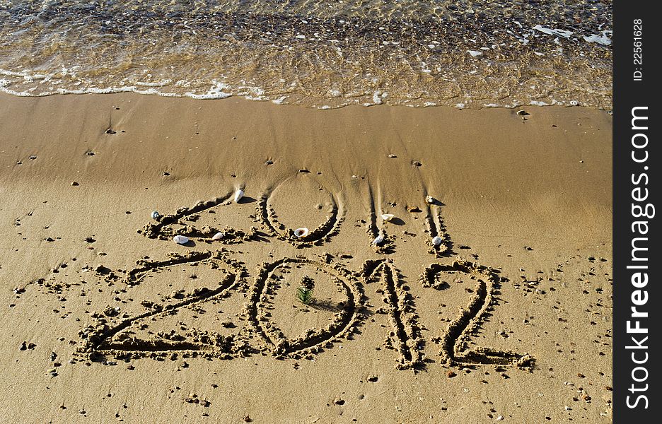 Message of 2012 New Year has came on the gold sandy beach of the Red Sea near Eilat. Message of 2012 New Year has came on the gold sandy beach of the Red Sea near Eilat