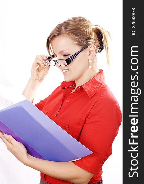 Portrait of a beautiful young business woman holding a folder, considering options. Portrait of a beautiful young business woman holding a folder, considering options