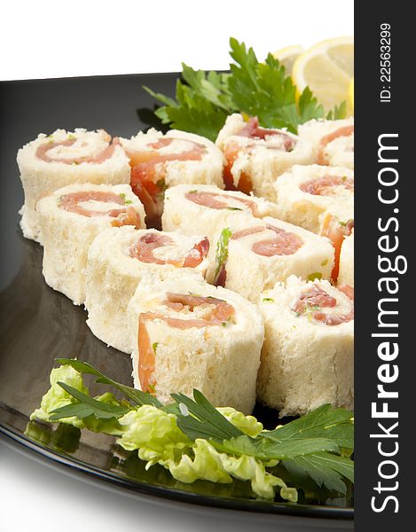 Delicious smoked salmon rolls on a white background. Delicious smoked salmon rolls on a white background