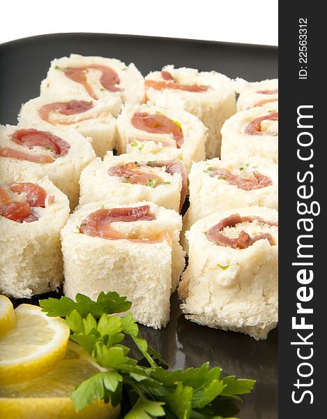 Delicious smoked salmon rolls on a white background. Delicious smoked salmon rolls on a white background