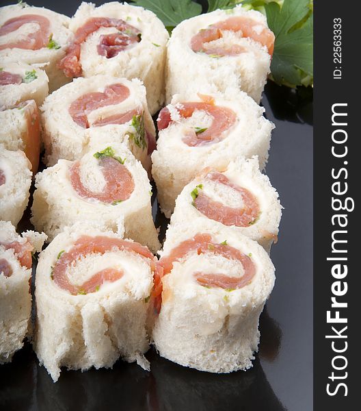 Delicious smoked salmon rolls on a white background. Delicious smoked salmon rolls on a white background