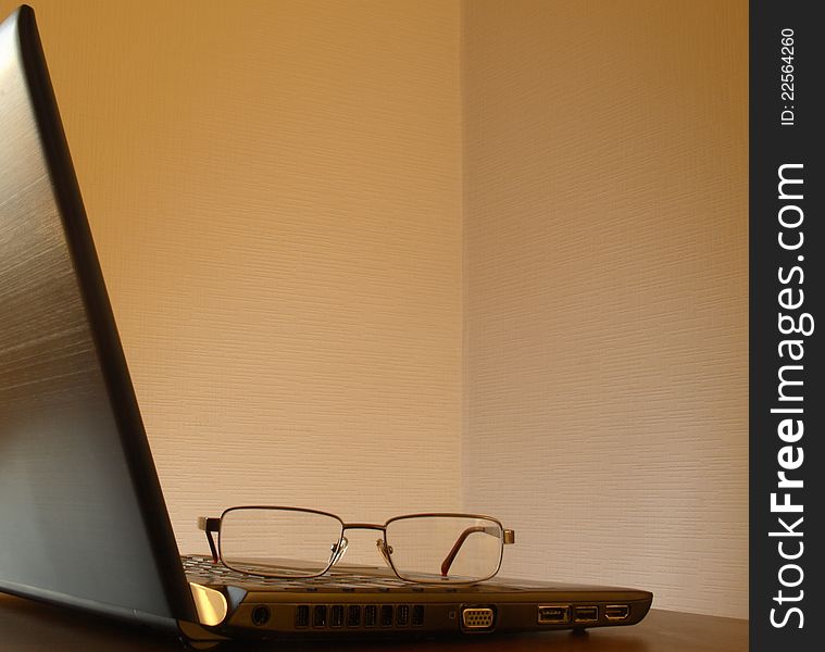 Glasses on the laptop. See similar image in my portfolio.