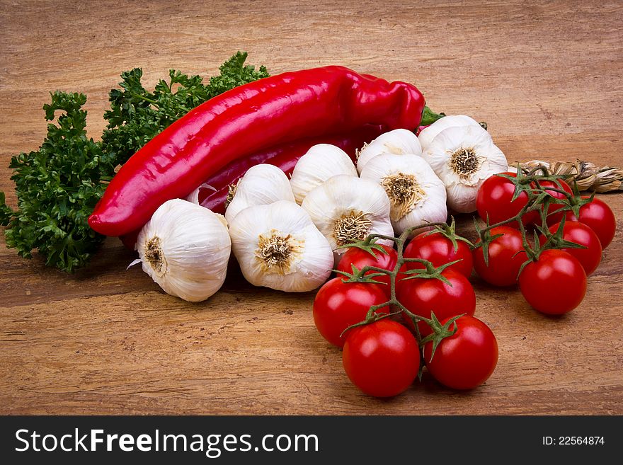 Fresh vegetables on the wooden background