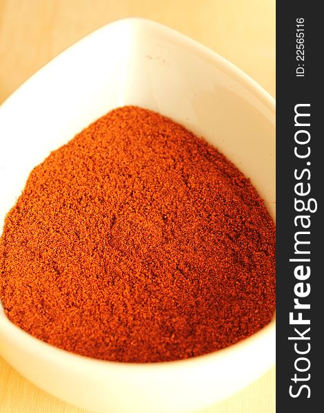 Close-up of dry paprika in a white bowl