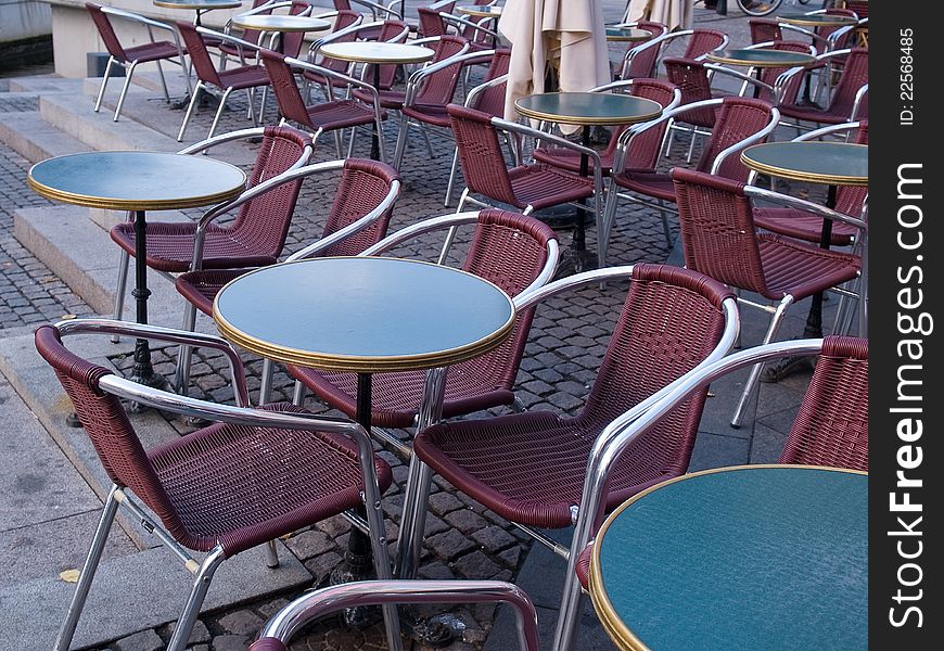 Classic style European street outdoors cafe with tables and chairs Copenhagen Denmark. Classic style European street outdoors cafe with tables and chairs Copenhagen Denmark