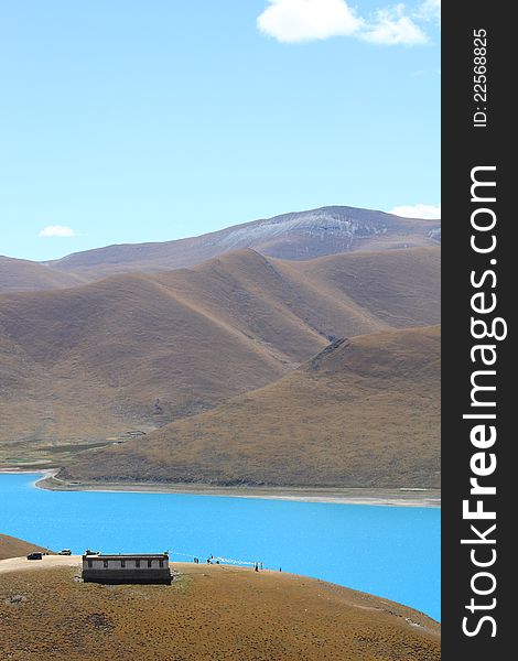 Yamdrok Lake is one of the three largest sacred lakes in Tibet. It is over 72 km long. The lake is surrounded by many snow-capped mountains and is fed by numerous small streams. The lake does have an outlet stream at its far western end. Around 90 km to the west of the lake lies the Tibetan town of Gyantse and Lhasa is a hundred km to the northeast. According to local mythology, Yamdok Yumtso lake is the transformation of a goddess.