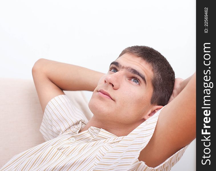 Portrait of a young man relaxing at home. Portrait of a young man relaxing at home