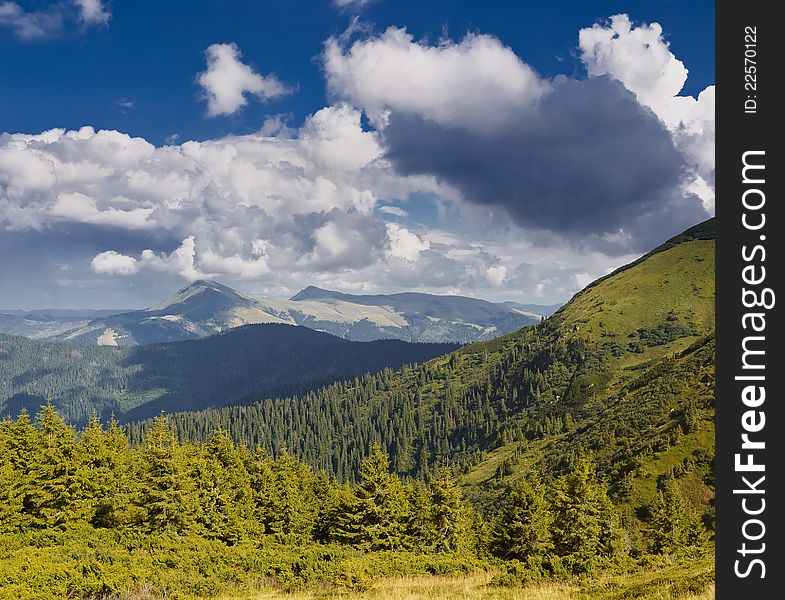 Summer sunny landscape with a cloudy sky. Ukraine, the Carpathian mountains. Summer sunny landscape with a cloudy sky. Ukraine, the Carpathian mountains.