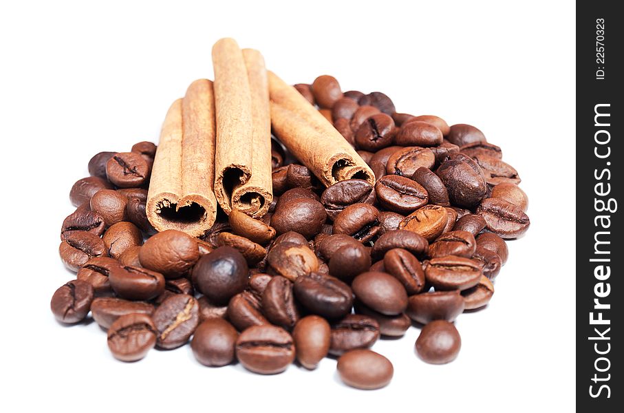 Coffee beans and cinnamon on a white background