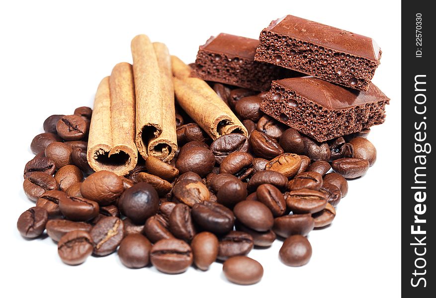 Chocolate, Cinnamon and coffee beans on a white background