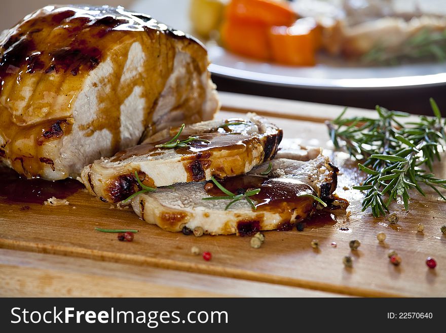 Roasted Pork slices cut on a wooden board