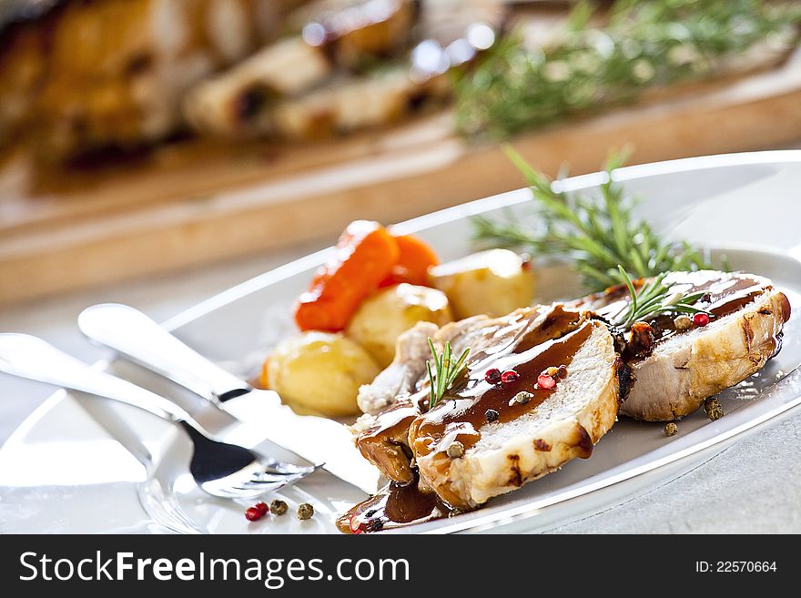 Close up photograph of slices of roasted pork