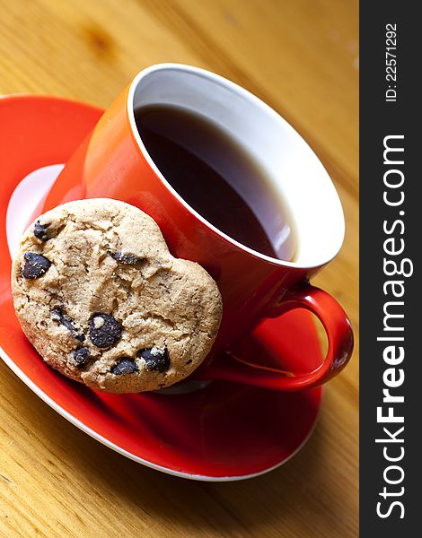 Cap of tea and cookies on a wooden table