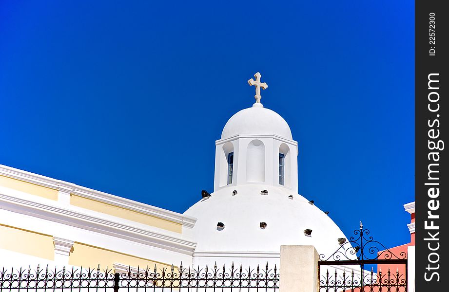 Against the background of blue sky, white dome of a small church looks very bright. He seemed to glow in the sun. Against the background of blue sky, white dome of a small church looks very bright. He seemed to glow in the sun.