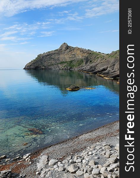 The pointed cape juts far into the Black Sea. This headland together with cape Hoba-Kaya have formed the Blue bay of Novij Svet. The pointed cape juts far into the Black Sea. This headland together with cape Hoba-Kaya have formed the Blue bay of Novij Svet.