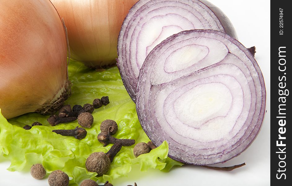 Garlic and onion vegetables with salad spice isolated on white background