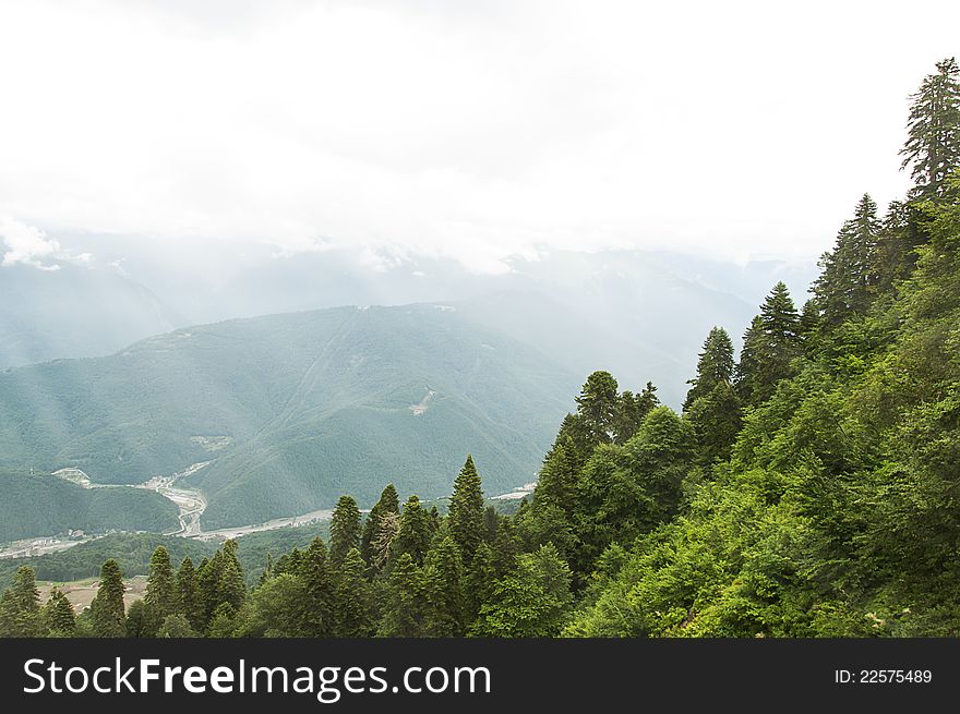 Mountain landscape with sun rays