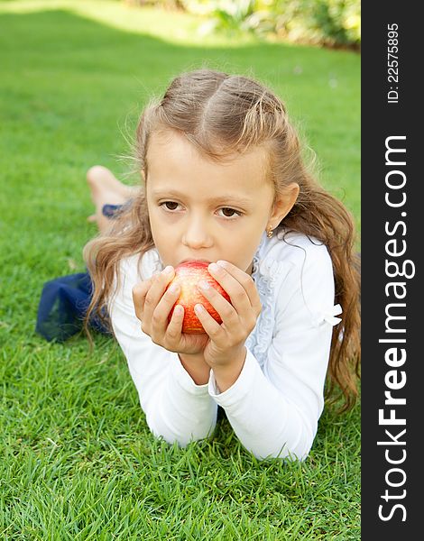 Girl eating an apple