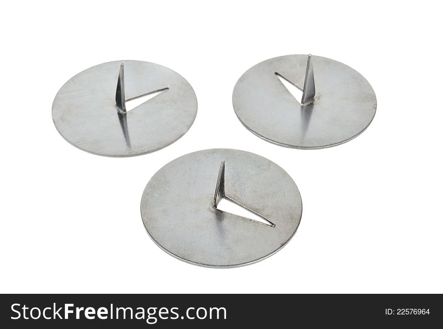 Three drawing pins (thumbtacks) isolated against a white background
