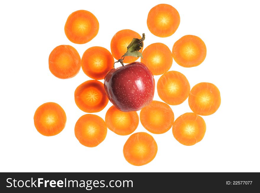 A red apple with carrot slices isolated on a white background