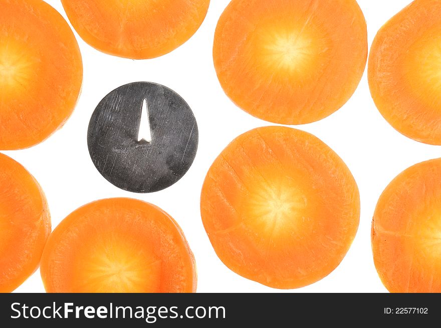 A conceptual image of a drawing pin (symbolizing bad bacteria) among carrot slices. A conceptual image of a drawing pin (symbolizing bad bacteria) among carrot slices