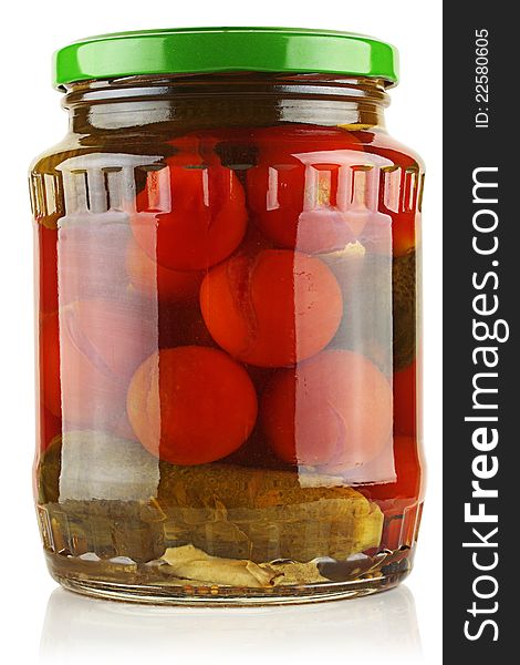 Canned tomatoes and cucumbers in a glass jar. Canned tomatoes and cucumbers in a glass jar.