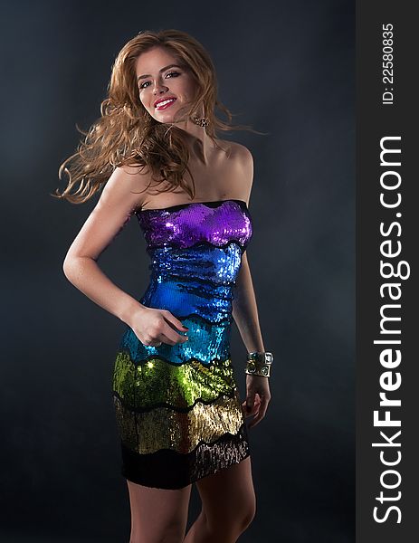 Nightlife- pretty young woman in disco clothes dancing. Nightlife- pretty young woman in disco clothes dancing