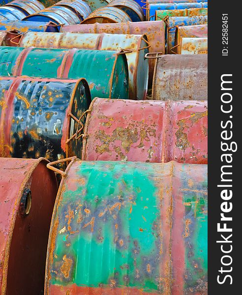 Row of rusty metal drums