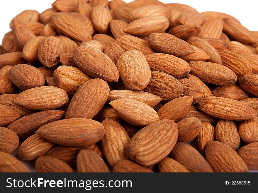 Pile of  almonds isolated over white background