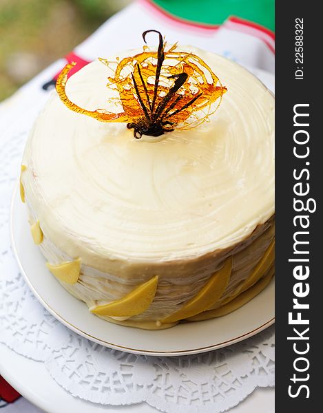 Vanilla, mango and white chocolate layer cake. Vanilla, mango and white chocolate layer cake