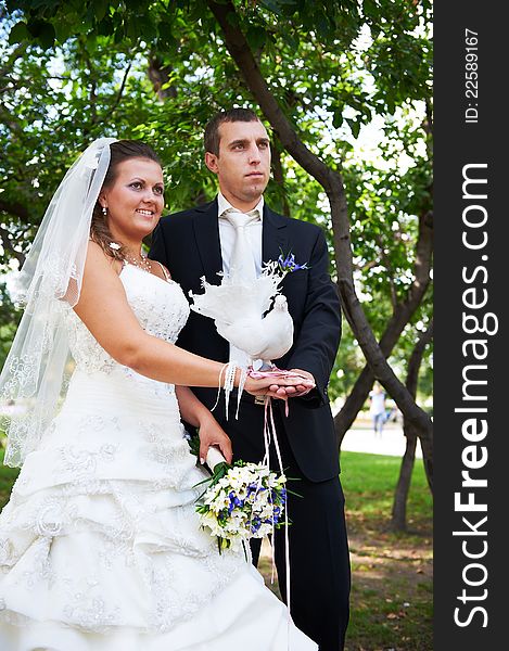 Bride and groom with pigeons