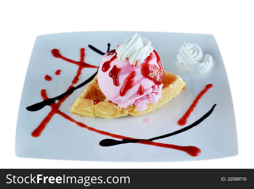 Waffle and whipping cream with strawberry ice cream. Waffle and whipping cream with strawberry ice cream