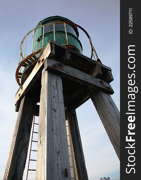 The green lighthouse on the end of whitby pier. The green lighthouse on the end of whitby pier