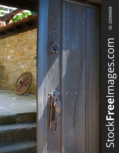 Ancient wooden door with ancient security lock of an old house in Jeravna &#x28;Zheravna&#x29;  village, Bulgaria