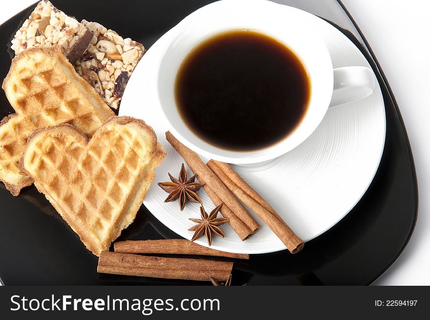 Aromatic cup of coffee, cinnamon, anise and cookie