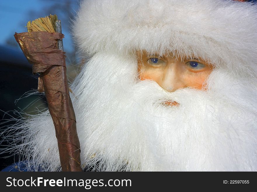 Closeup portrait of Santa Claus doll showing full beard